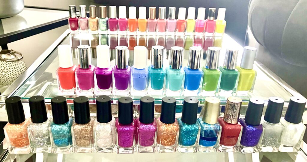 Four rows of bright colourful nail polishes