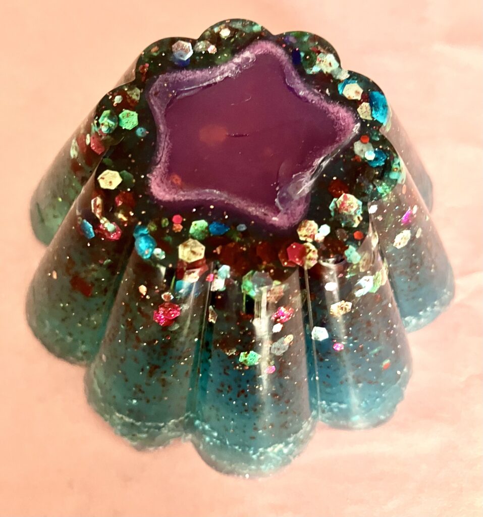 Green glittery soap with a with a pink star center.
